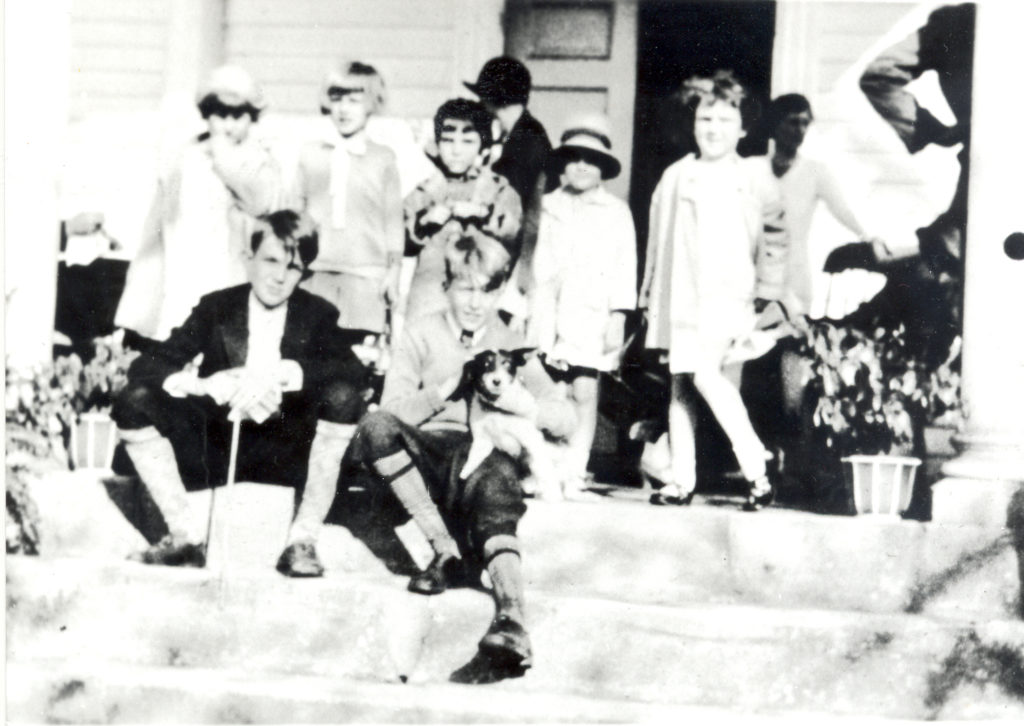 Egg Hunt Attendees at Belmont. Group of nicely dressed young kids sitting on steps