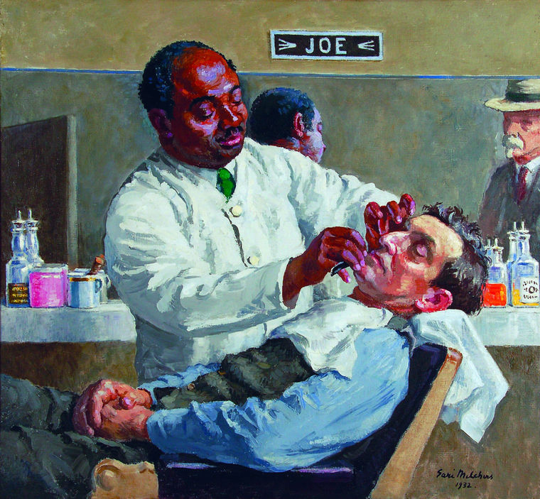 Man being shaved by barber
